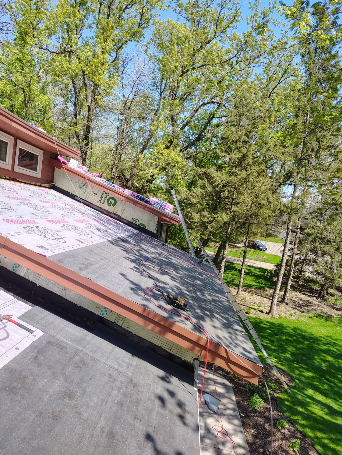 Roof tear-off and underlayment in progress